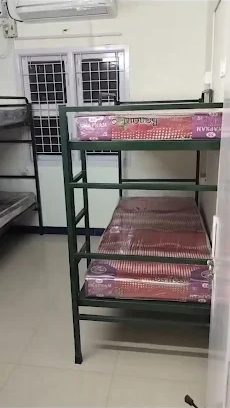 Bunk bed in a room with a wall-mounted air conditioner
